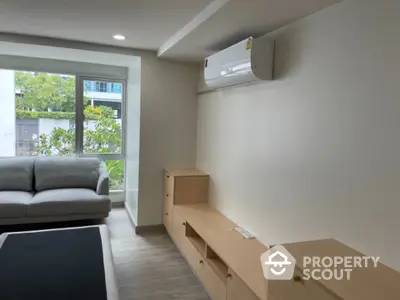 Modern living room with air conditioning and natural light