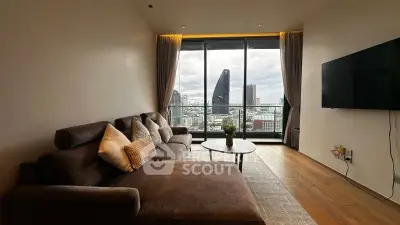Modern living room with stunning city view and cozy seating area.