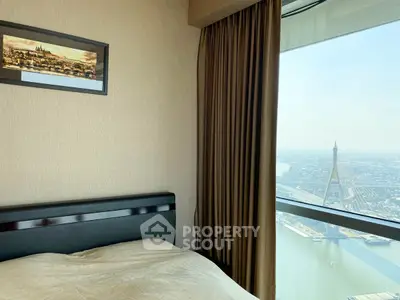 Luxurious bedroom with stunning city and river view from high-rise window