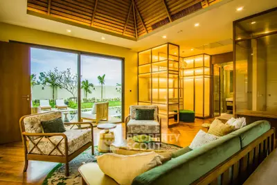 Luxurious living room with elegant furniture and garden view, perfect for relaxation and entertaining.