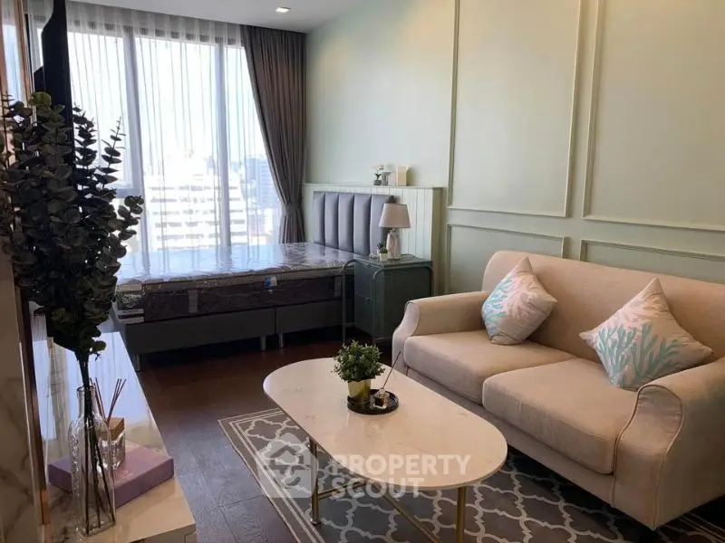 Chic studio apartment with stylish decor and natural light in urban setting.