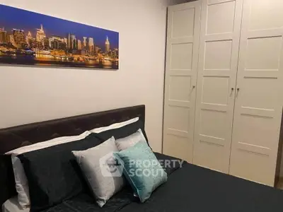 Cozy bedroom with stylish decor and ample storage space