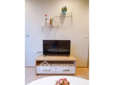 Modern living room with stylish TV stand and wall shelves