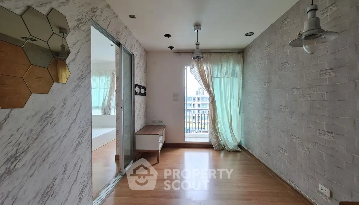 Bright and airy room with wooden flooring and modern decor