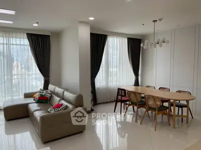 Spacious modern living room with elegant dining area and natural light