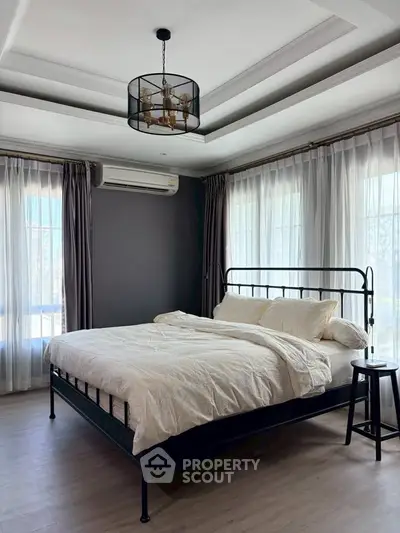 Elegant bedroom with modern decor and natural light