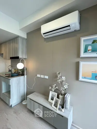 Modern living room with stylish decor and air conditioning in a contemporary apartment.