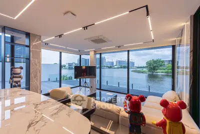 Luxurious modern living room with panoramic river view and stylish decor