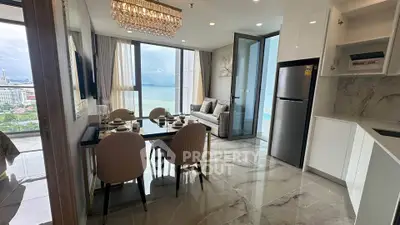 Luxurious open-plan living room with stunning sea view and modern kitchen