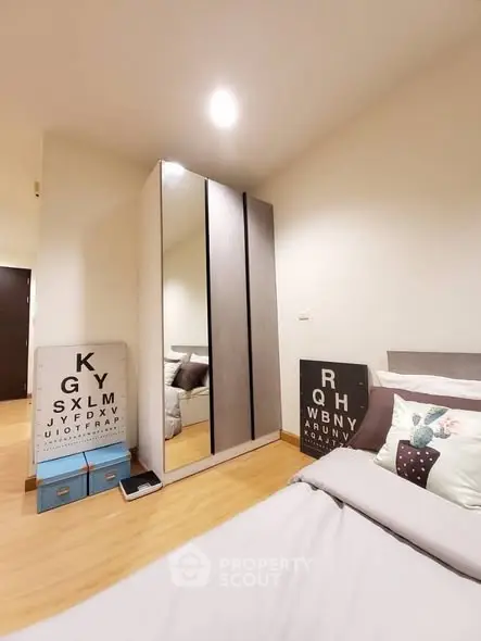 Cozy bedroom with modern wardrobe and stylish decor