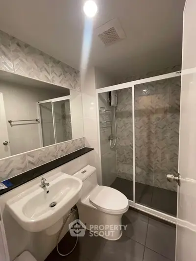 Modern bathroom with sleek shower and stylish tile design