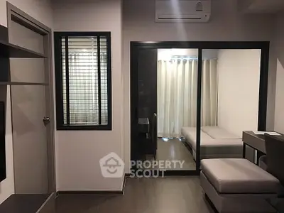 Modern apartment interior with sliding glass doors and cozy furnishings