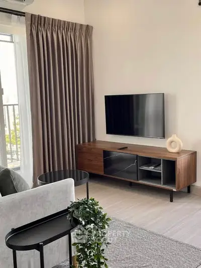 Modern living room with sleek TV setup and elegant decor
