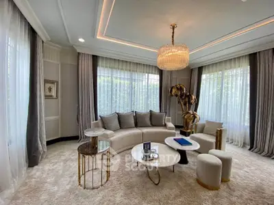 Luxurious living room with elegant decor, plush seating, and large windows offering abundant natural light.