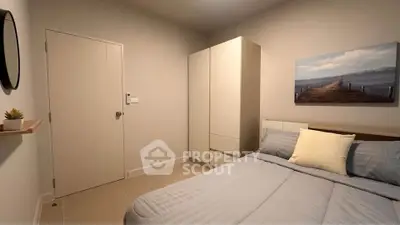 Cozy bedroom with modern decor and ample storage space