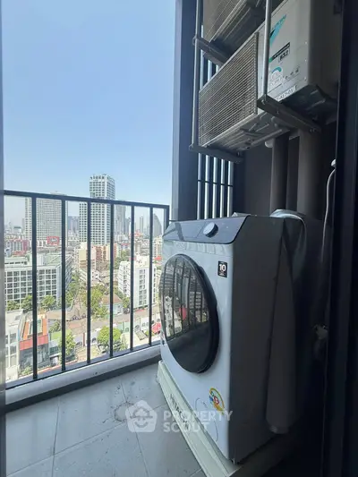 High-rise balcony with city view and washing machine, perfect for urban living.
