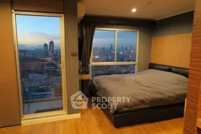 Modern bedroom with stunning city view and large windows in high-rise apartment