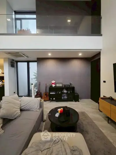 Modern living room with high ceiling and stylish decor