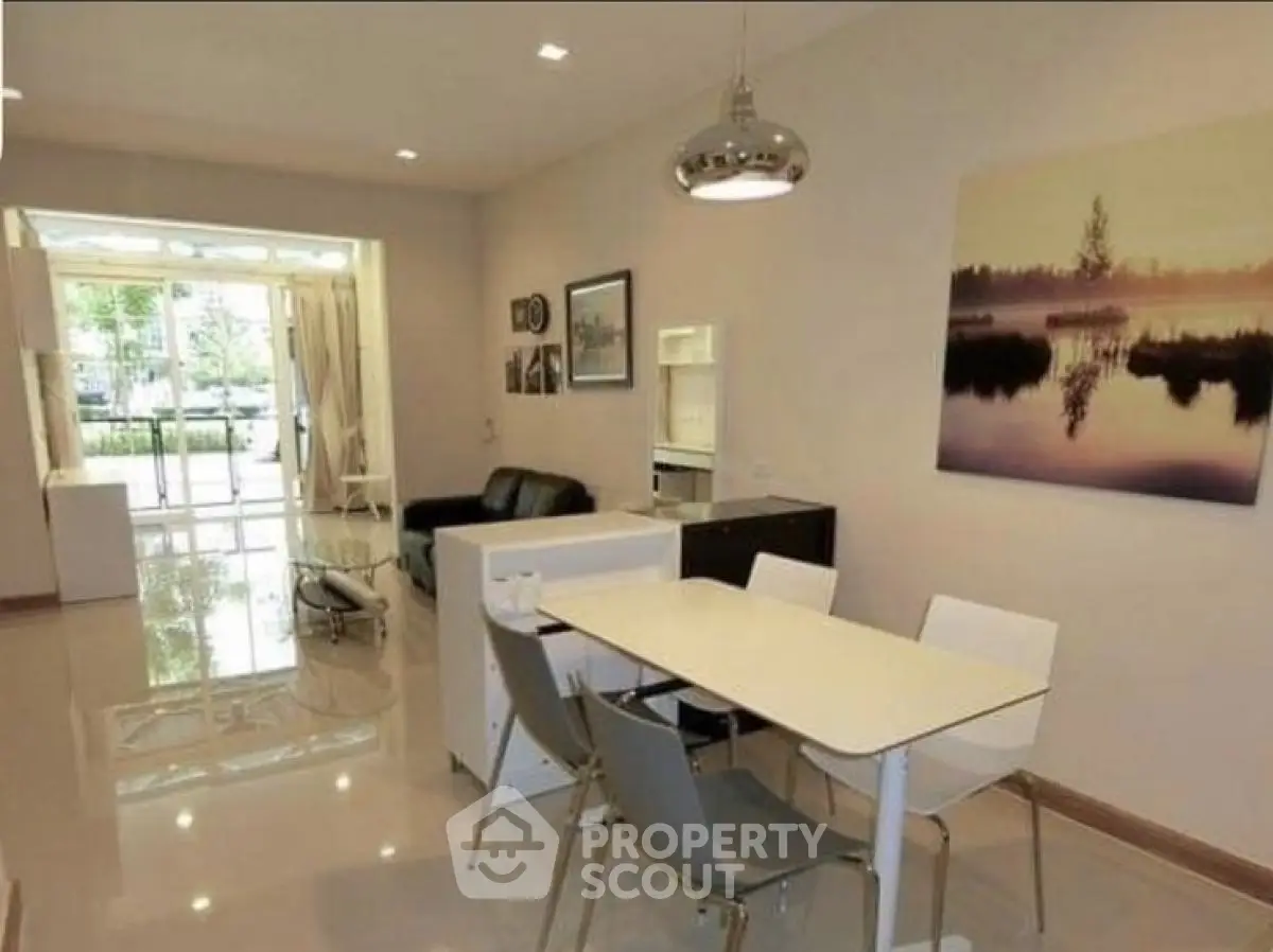 Modern open-plan living and dining area with stylish decor and natural light