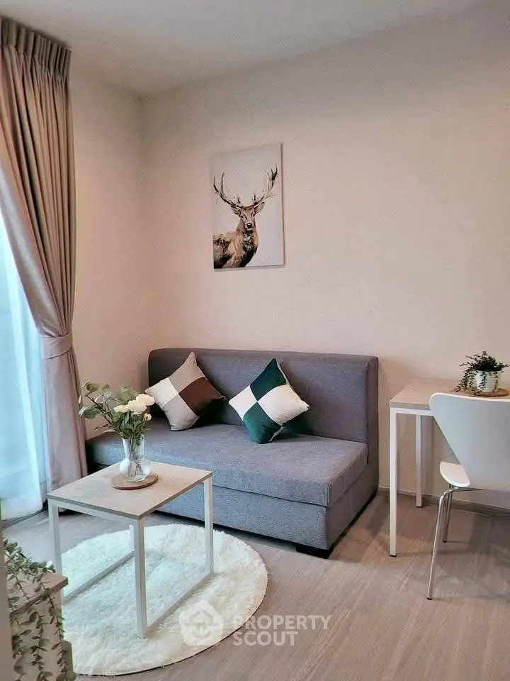 Cozy living room with modern decor, featuring a stylish sofa, elegant curtains, and a chic coffee table.