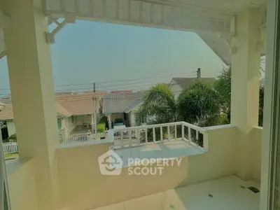 Charming balcony with scenic neighborhood view, perfect for relaxation and enjoying the outdoors.