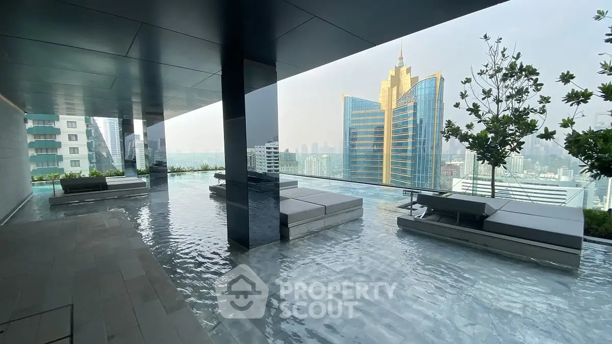 Luxurious rooftop pool with stunning city skyline view and modern lounge area.