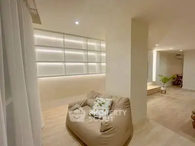 Modern living room with cozy seating and ambient lighting