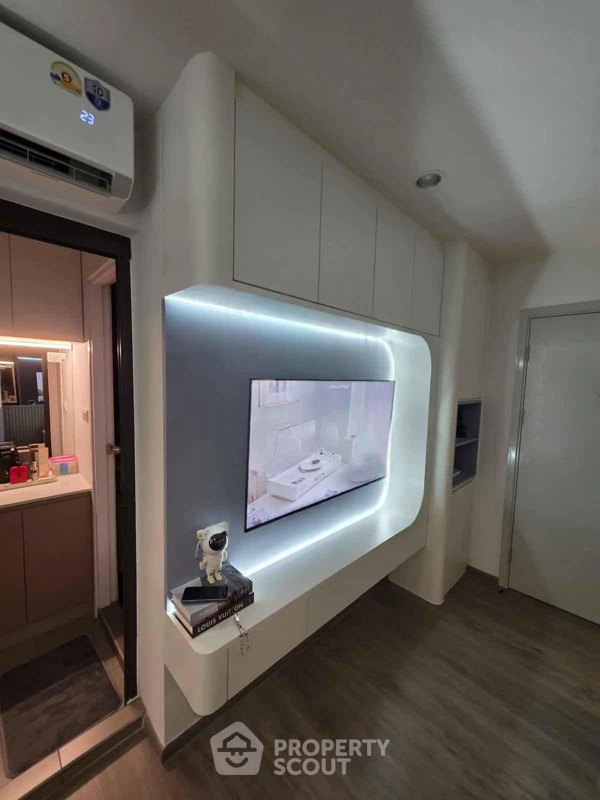 Modern living room with sleek TV wall unit and ambient lighting