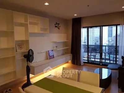 Modern living room with balcony view in high-rise apartment