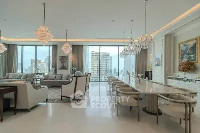 Luxurious open-plan living room with elegant chandeliers and city view