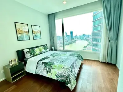Stunning bedroom with panoramic city view and elegant decor