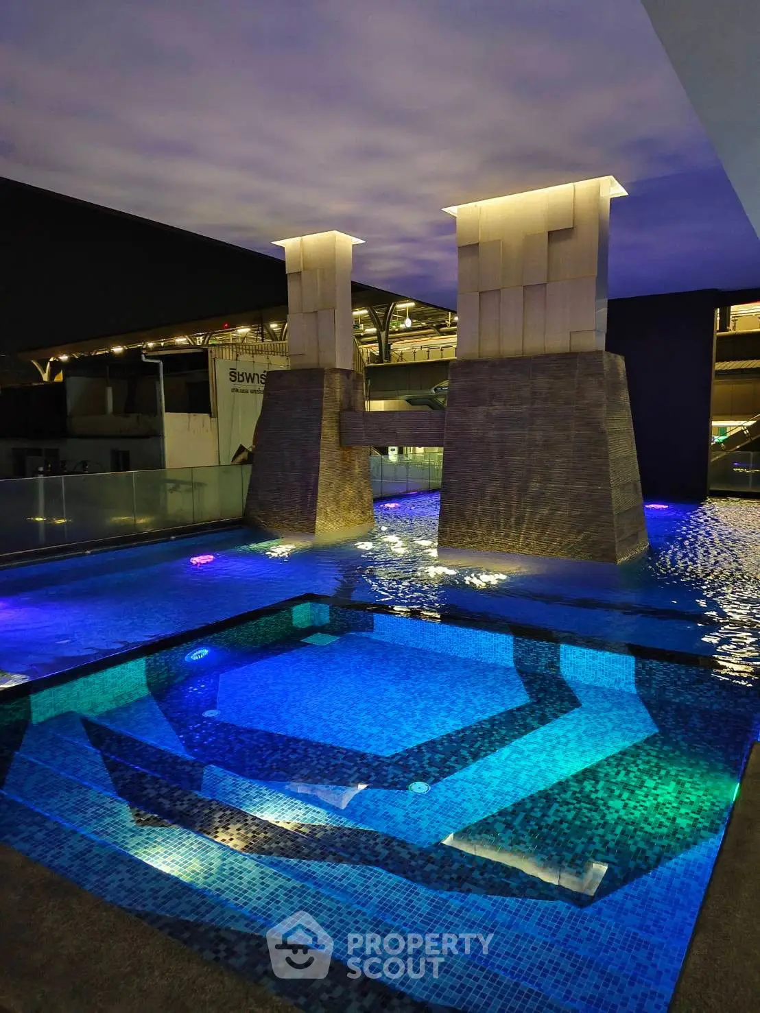 Luxurious indoor pool with modern architectural design and ambient lighting