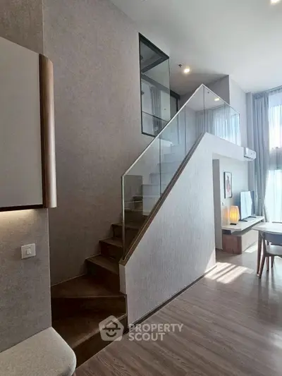 Modern duplex interior with stylish staircase and natural light