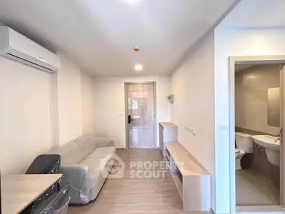 Modern living room with sleek furniture and air conditioning in a cozy apartment.