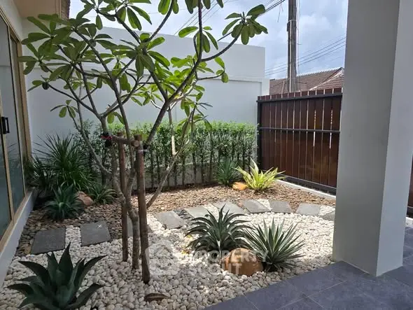 Charming garden view with lush greenery and modern landscaping in a serene residential setting.