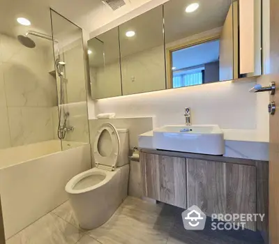 Modern bathroom with sleek fixtures and elegant design in a luxury apartment.