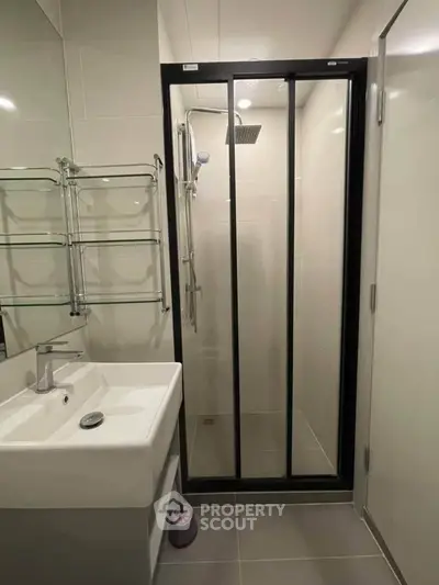 Modern bathroom with sleek shower enclosure and stylish sink