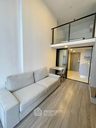 Modern loft apartment with high ceilings and cozy living area