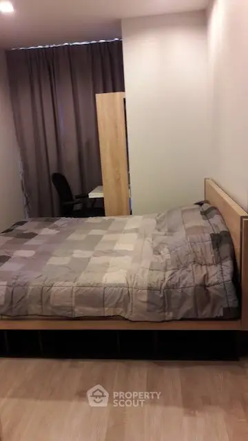 Cozy bedroom with modern decor and comfortable bed in a stylish apartment.