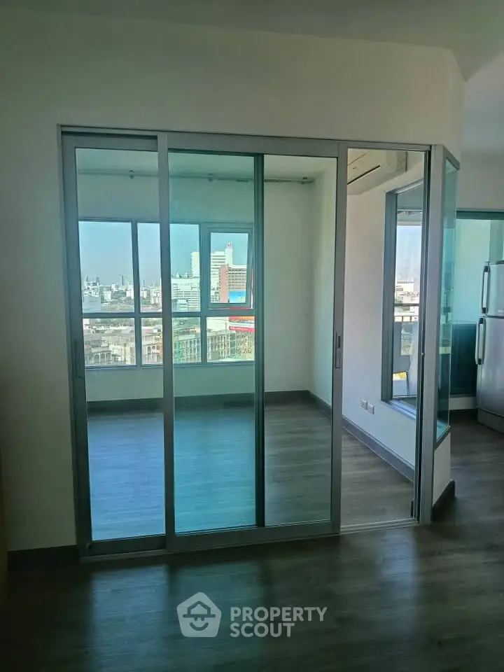 Modern apartment with glass sliding doors and city view