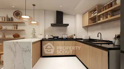 Modern kitchen with sleek cabinetry and marble island in a stylish apartment.