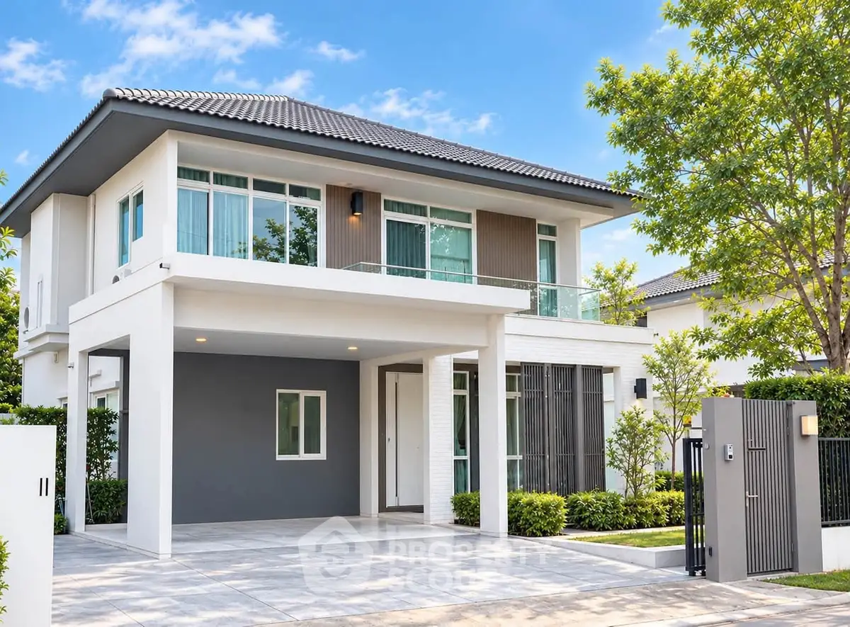 Modern two-story house with sleek design and spacious driveway in a serene neighborhood.