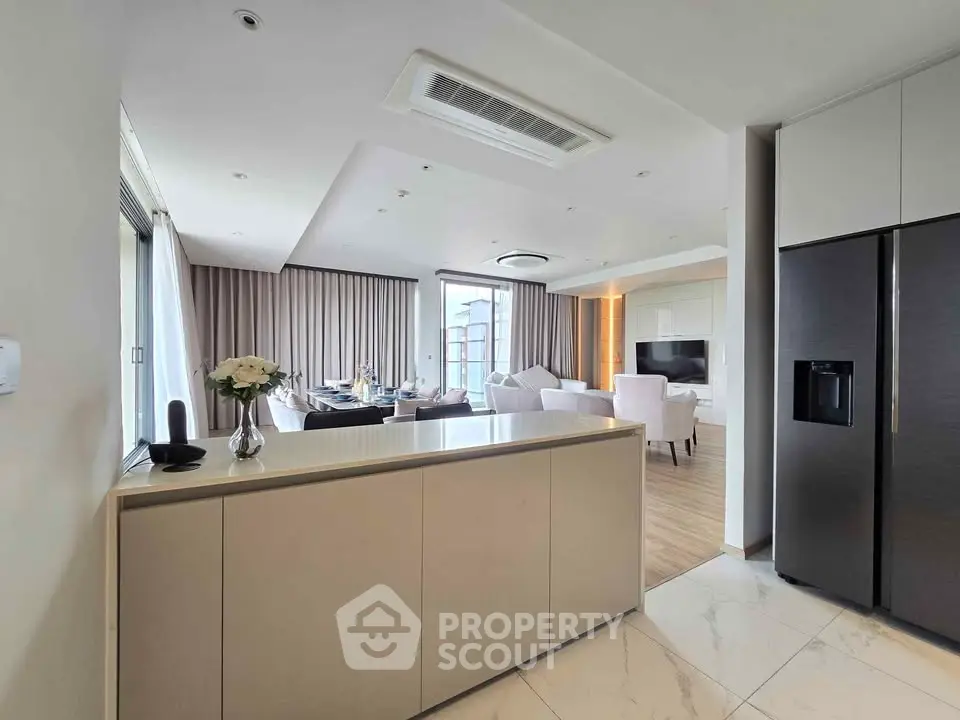 Spacious modern living room with open kitchen and elegant decor