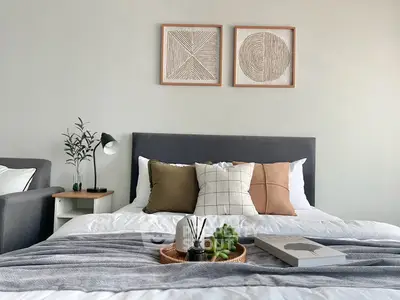 Stylish bedroom with modern decor and cozy bedding