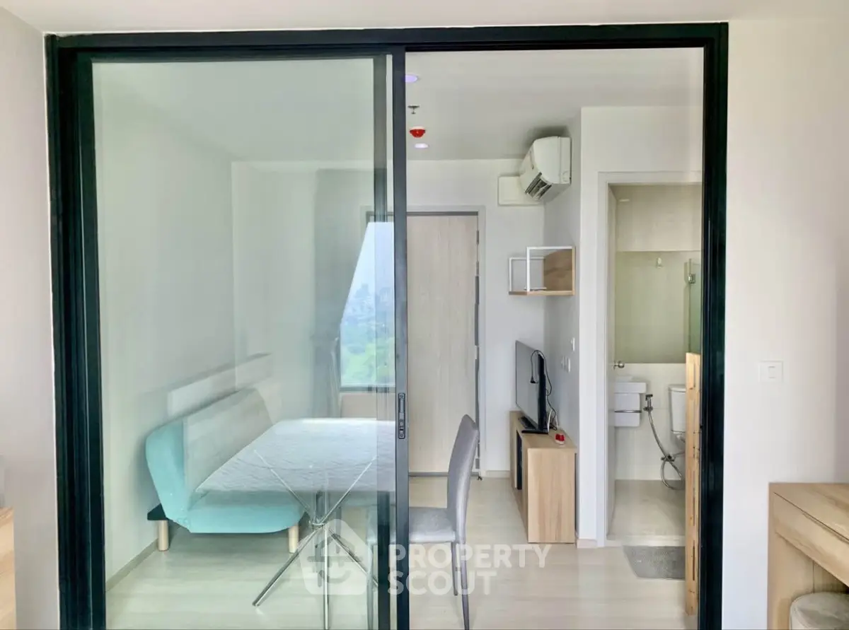 Modern apartment with glass sliding doors and minimalist decor