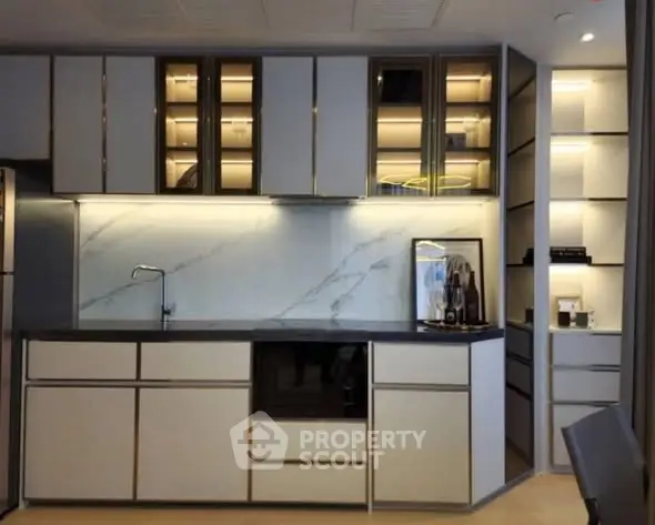 Modern kitchen with sleek cabinetry and built-in appliances