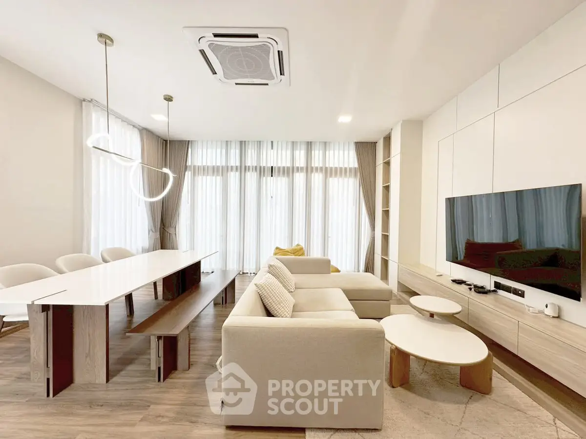 Spacious modern living room with elegant furniture and natural light