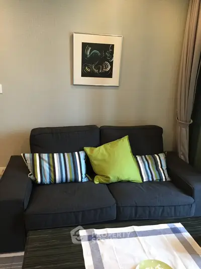 Cozy living room with stylish sofa and modern art decor
