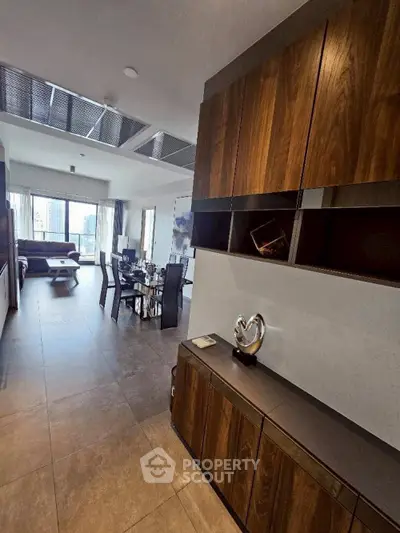 Luxurious open-plan living room with modern dining area and elegant decor