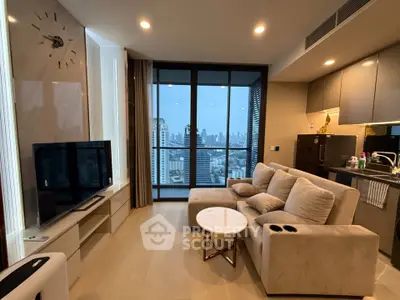 Modern living room with city view, cozy sofa, and sleek kitchen in luxury apartment.